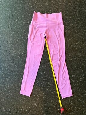 Athleta brand Women’s Pink High-Rise Salutation Stash 7/8 length tight